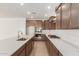 Open kitchen with a large island, stainless steel appliances, and plenty of counter space at 25215 N 131St Dr, Peoria, AZ 85383