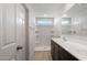 Well-lit bathroom featuring a dual sink vanity and a refreshing walk-in shower for a spa-like experience at 25248 W Chanute Pass, Buckeye, AZ 85326