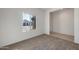 Cozy carpeted bedroom with a window offering natural light and a view of the neighborhood at 25248 W Chanute Pass, Buckeye, AZ 85326