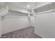 This walk-in closet provides ample storage with multiple shelves and rods, catering to your organizational needs at 25248 W Chanute Pass, Buckeye, AZ 85326