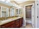 Bathroom with dual sinks, granite countertop, tiled floor, and shower-tub combo at 2727 S Equestrian Dr # 103, Gilbert, AZ 85295