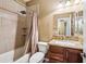 Bathroom features shower-tub combo with wood vanity and granite countertops at 2727 S Equestrian Dr # 103, Gilbert, AZ 85295