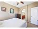 Cozy bedroom with carpet flooring, ensuite bathroom, ceiling fan, and natural light at 2727 S Equestrian Dr # 103, Gilbert, AZ 85295
