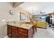 Spacious kitchen island with granite countertops and pendant lighting, seamlessly connecting the dining and living spaces at 2727 S Equestrian Dr # 103, Gilbert, AZ 85295