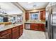 Open concept kitchen with granite countertops, stainless steel appliances, and tile flooring at 2727 S Equestrian Dr # 103, Gilbert, AZ 85295