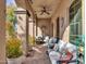 Cozy covered patio area with comfortable seating and stylish decor at 2957 N Riley Ct, Buckeye, AZ 85396