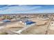 An aerial view of a single-Gathering home, featuring desert landscaping and a paved drive at 30634 W Latham St, Buckeye, AZ 85326