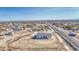 A single-story home with a gray tiled roof sits on a large lot ready for landscaping at 30634 W Latham St, Buckeye, AZ 85326