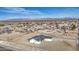 This beautiful home boasts a gray roof and a desert landscape at 30634 W Latham St, Buckeye, AZ 85326