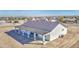 An aerial view of a single-Gathering home featuring desert landscaping and a covered patio at 30634 W Latham St, Buckeye, AZ 85326