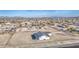 Expansive aerial view of a new home with generous surrounding land in a developing residential area at 30634 W Latham St, Buckeye, AZ 85326
