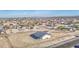 Expansive aerial view of a new home with generous surrounding land in a developing residential area at 30634 W Latham St, Buckeye, AZ 85326
