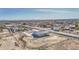 An aerial view of a single-Gathering home featuring desert landscaping and mountain views at 30634 W Latham St, Buckeye, AZ 85326