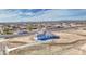This lovely home features an attached 3-car garage and desert landscaping at 30634 W Latham St, Buckeye, AZ 85326