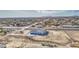 An aerial view of a white single Gathering home featuring desert landscaping and a two car garage at 30634 W Latham St, Buckeye, AZ 85326