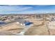 An aerial view of a single-Gathering home featuring desert landscaping and a paved drive at 30634 W Latham St, Buckeye, AZ 85326