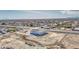 An aerial view of a single-Gathering home featuring desert landscaping, a two car garage and blue trim at 30634 W Latham St, Buckeye, AZ 85326