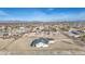 Expansive aerial view of a new home with generous surrounding land in a developing residential area at 30634 W Latham St, Buckeye, AZ 85326
