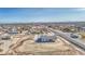 Expansive aerial view of a new home with generous surrounding land in a developing residential area at 30634 W Latham St, Buckeye, AZ 85326