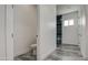 Hallway view showing access to a bathroom with a shower and a separate toilet at 30634 W Latham St, Buckeye, AZ 85326