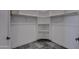 Spacious walk-in closet with built-in shelves and rods for ample storage at 30634 W Latham St, Buckeye, AZ 85326