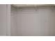 Close-up of a closet with built-in shelving and rods for organization at 30634 W Latham St, Buckeye, AZ 85326