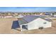 Aerial view of a white home featuring a spacious covered patio with columns at 30634 W Latham St, Buckeye, AZ 85326