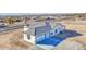 A charming single-story home with a gray tiled roof, white trim and a large two car garage at 30634 W Latham St, Buckeye, AZ 85326