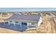 Aerial view of a white home featuring a spacious covered patio with columns at 30634 W Latham St, Buckeye, AZ 85326