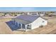 Aerial view of a white home featuring a spacious covered patio with columns at 30634 W Latham St, Buckeye, AZ 85326