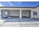 Spacious two-car garage with automatic door openers and ample space for parking and storage at 30634 W Latham St, Buckeye, AZ 85326