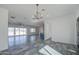 Spacious living room with tile floors and glass sliding doors to patio at 30634 W Latham St, Buckeye, AZ 85326