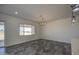 Bright living room with window and tiled floors at 30634 W Latham St, Buckeye, AZ 85326