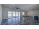 A spacious living room features large sliding glass doors offering ample light and views of the outdoors at 30634 W Latham St, Buckeye, AZ 85326