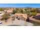 Aerial view of a desert home showcasing a private pool, mature landscaping, and a tile roof at 4044 E Cascalote Dr, Cave Creek, AZ 85331