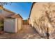 Backyard with a storage shed, and gated access to a side yard at 4044 E Cascalote Dr, Cave Creek, AZ 85331
