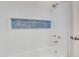 Bathroom featuring a sleek bathtub with subway tile and blue accent window at 4044 E Cascalote Dr, Cave Creek, AZ 85331