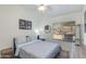 Cozy bedroom with a ceiling fan, a window with blinds, a comfortable bed, and minimalist décor at 4044 E Cascalote Dr, Cave Creek, AZ 85331