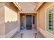Charming home entrance featuring a security door and a cute potted cactus next to an exterior window at 4044 E Cascalote Dr, Cave Creek, AZ 85331