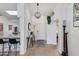 Bright foyer with modern chandelier, console table, and views into the living spaces and hallway at 4044 E Cascalote Dr, Cave Creek, AZ 85331