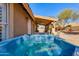 Outdoor view of the hot tub on the back patio area of this desert home at 4044 E Cascalote Dr, Cave Creek, AZ 85331