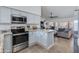 Modern kitchen with granite countertops, stainless steel appliances, and seamless flow to the living area at 4044 E Cascalote Dr, Cave Creek, AZ 85331