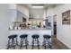 Kitchen featuring bar seating, granite counters, stainless steel appliances, and an open layout at 4044 E Cascalote Dr, Cave Creek, AZ 85331