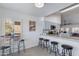 Bright, open kitchen featuring bar seating, granite counters, stainless steel appliances, and an open layout at 4044 E Cascalote Dr, Cave Creek, AZ 85331