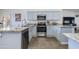 Kitchen with granite countertops, stainless steel appliances and a nearby door to the outdoor area at 4044 E Cascalote Dr, Cave Creek, AZ 85331
