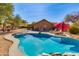 Inviting backyard pool with lounge chairs and desert landscaping for relaxing and entertaining at 4044 E Cascalote Dr, Cave Creek, AZ 85331