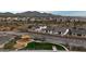 Aerial view of the community park and playground with mountain views in the background at 4334 W Acorn Valley Trl, New River, AZ 85087