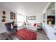 Living room featuring a comfortable couch, accent chair, hardwood floors, and a bright window at 4419 N 27Th St # 8, Phoenix, AZ 85016