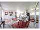 Open-concept living space with modern furnishings, natural light, and a dining area adjacent to the kitchen at 4419 N 27Th St # 8, Phoenix, AZ 85016