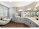 Bright bathroom featuring double vanity, soaking tub and modern fixtures for a luxurious experience at 4805 E Monte Cristo Ave, Scottsdale, AZ 85254